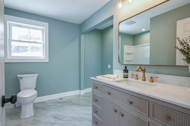 bathroom with vanity and toilet