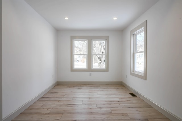 unfurnished room featuring light wood-type flooring