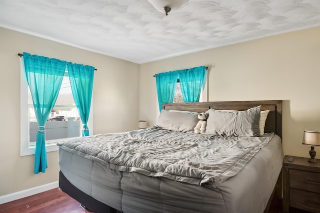 bedroom with hardwood / wood-style floors