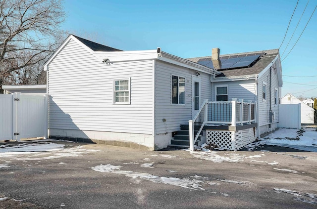 back of property with solar panels