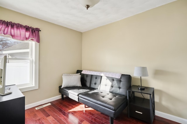 living area with dark hardwood / wood-style flooring