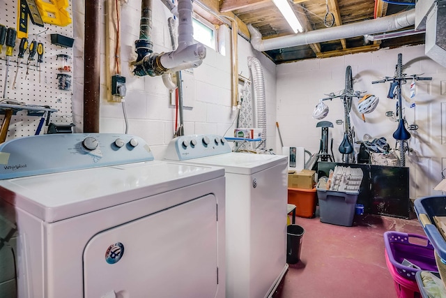 clothes washing area with separate washer and dryer