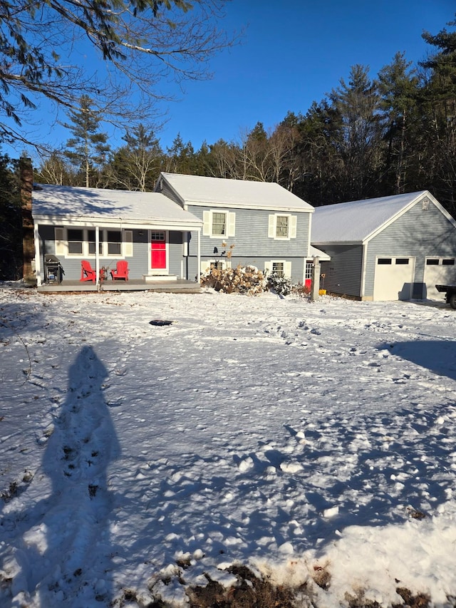 view of front facade featuring a porch and a garage