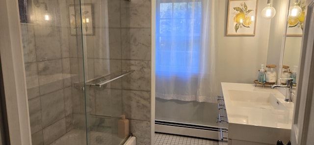 bathroom with vanity, walk in shower, and a baseboard heating unit