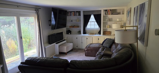 carpeted living room featuring a healthy amount of sunlight