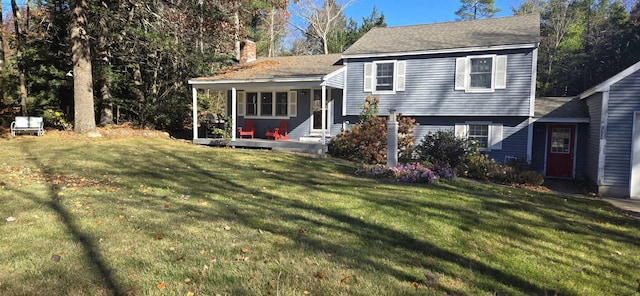 view of front of house featuring a porch and a front lawn