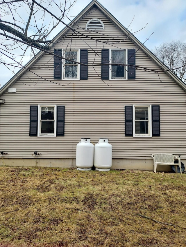 view of side of home featuring a yard