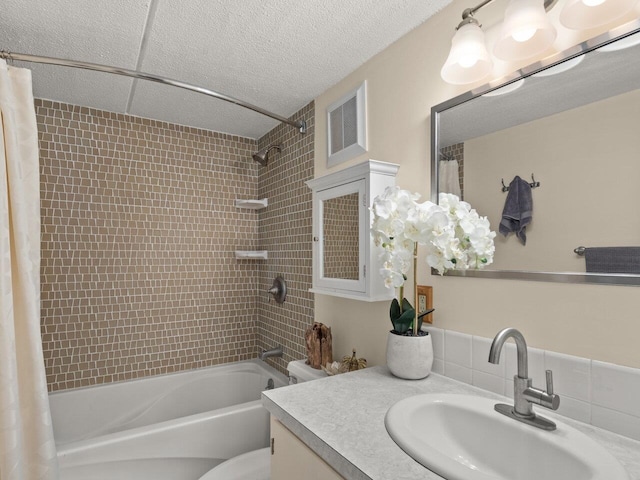 full bathroom with vanity, toilet, and shower / bath combo with shower curtain