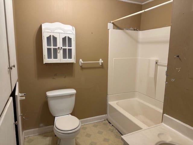 bathroom featuring toilet and  shower combination