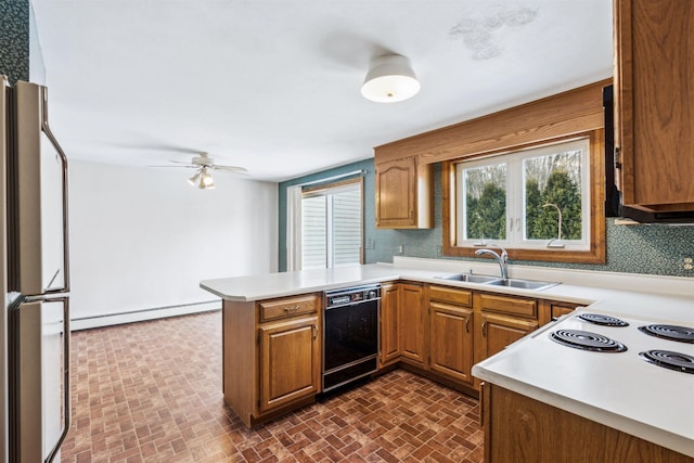 kitchen with baseboard heating, dishwasher, tasteful backsplash, kitchen peninsula, and fridge