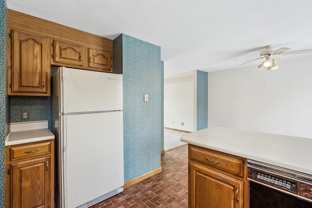 kitchen featuring dishwasher, ceiling fan, and white fridge