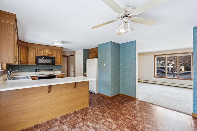 kitchen with white appliances, a baseboard radiator, sink, kitchen peninsula, and a breakfast bar