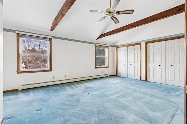 unfurnished bedroom with carpet floors, a baseboard heating unit, lofted ceiling with beams, ceiling fan, and multiple closets