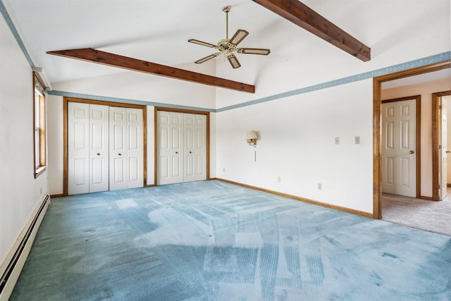 unfurnished bedroom with a baseboard radiator, carpet floors, lofted ceiling with beams, ceiling fan, and multiple closets