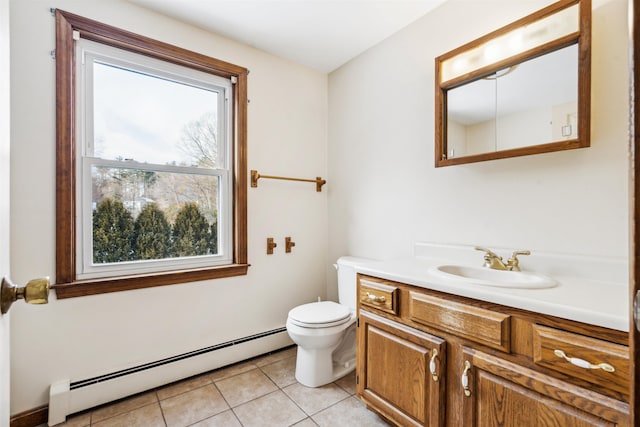 bathroom featuring toilet, tile patterned flooring, a baseboard heating unit, and vanity