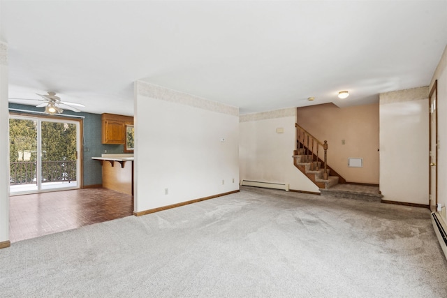 unfurnished living room featuring ceiling fan, light colored carpet, and a baseboard heating unit