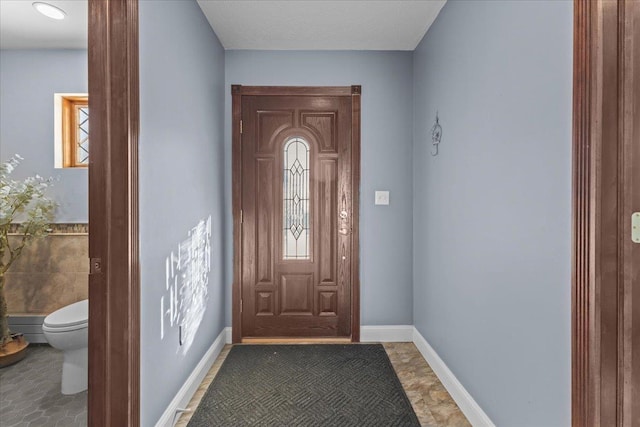 entryway with tile patterned floors