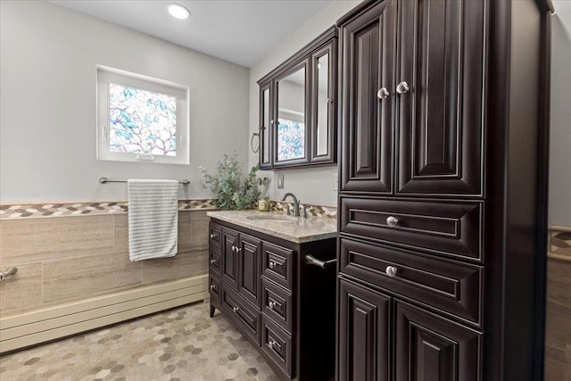 bathroom featuring a healthy amount of sunlight and vanity