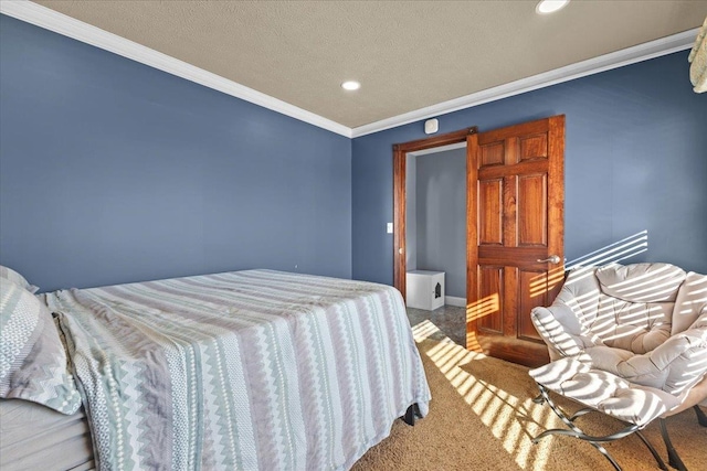 carpeted bedroom with crown molding and a textured ceiling