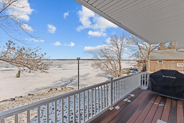 wooden terrace featuring a grill