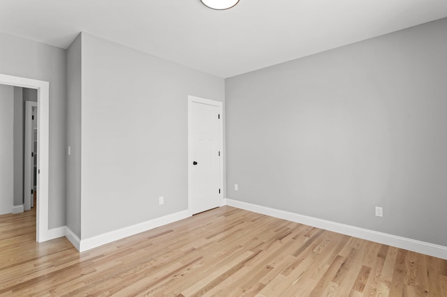 empty room with light hardwood / wood-style floors