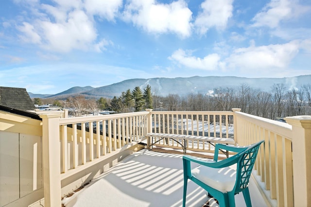 wooden deck with a mountain view