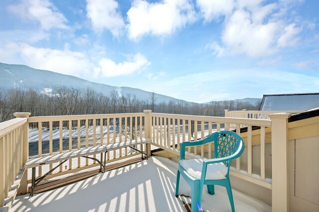 balcony with a deck with mountain view