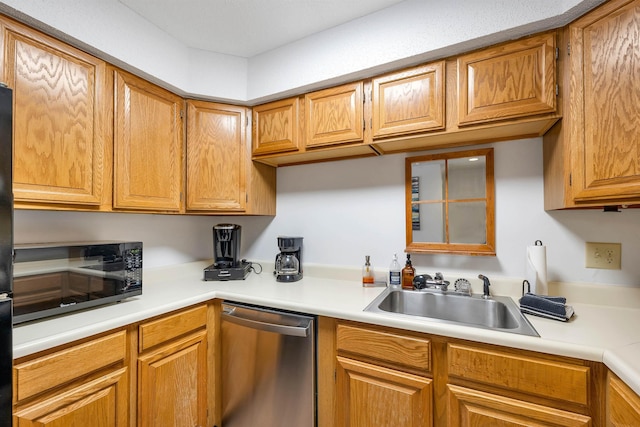 kitchen with sink and stainless steel dishwasher