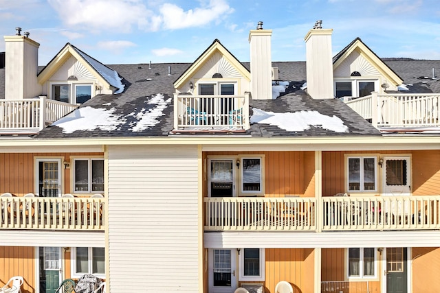 back of house featuring a balcony