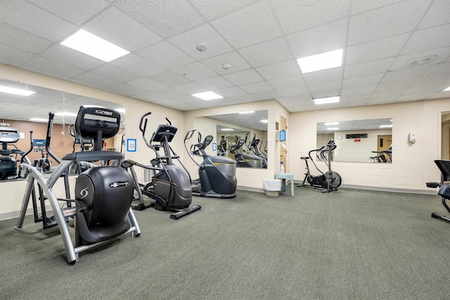 exercise room featuring a paneled ceiling