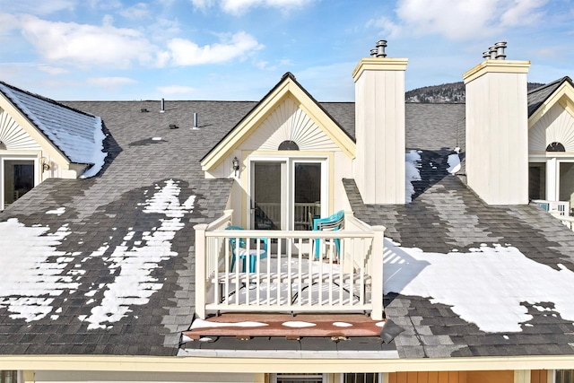 rear view of house featuring a balcony