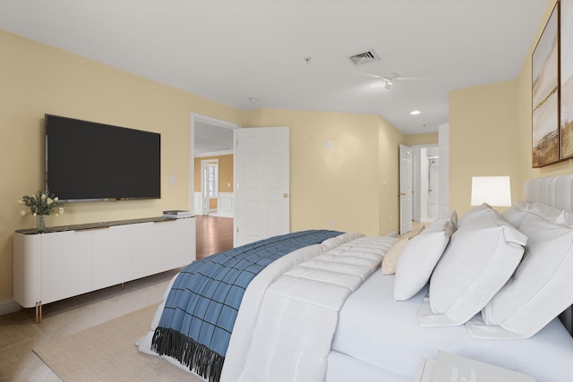 bedroom featuring light carpet