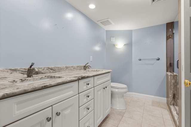 bathroom with toilet, tile patterned flooring, a shower, and vanity