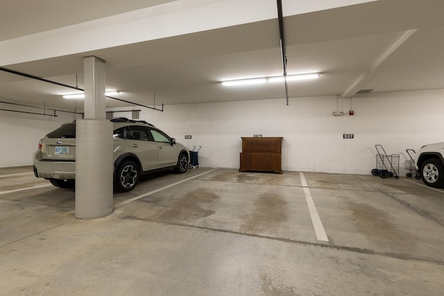 garage featuring a carport