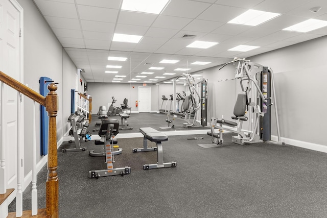 exercise room featuring a paneled ceiling