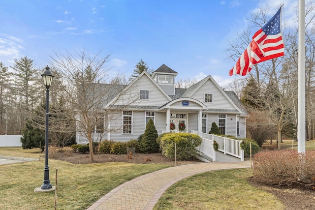 view of front of home with a front lawn