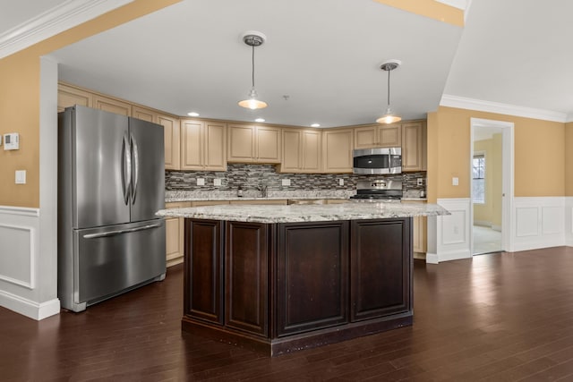 kitchen with appliances with stainless steel finishes, dark brown cabinetry, ornamental molding, pendant lighting, and light stone counters