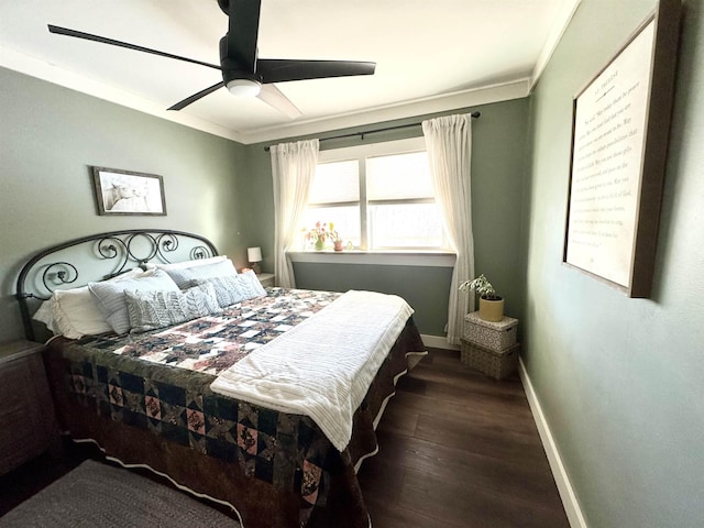 bedroom featuring ceiling fan, dark hardwood / wood-style flooring, and crown molding