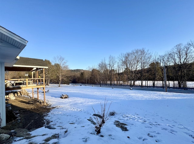 view of yard layered in snow