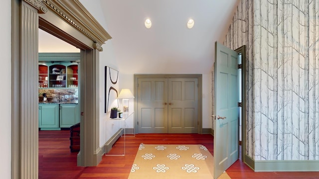 hall with hardwood / wood-style floors