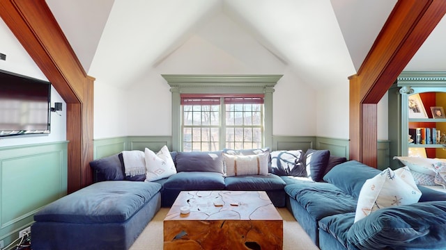 living room with ornate columns and vaulted ceiling