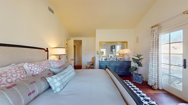 bedroom featuring lofted ceiling and wood-type flooring