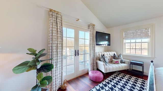 doorway to outside featuring french doors, wood-type flooring, vaulted ceiling, and a wealth of natural light