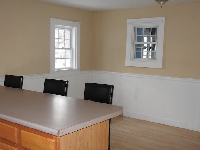 office area with light hardwood / wood-style floors