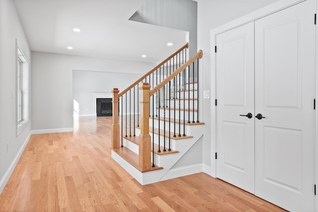 stairs featuring wood-type flooring