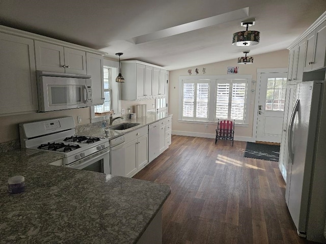 kitchen featuring decorative light fixtures, sink, white cabinetry, white appliances, and lofted ceiling