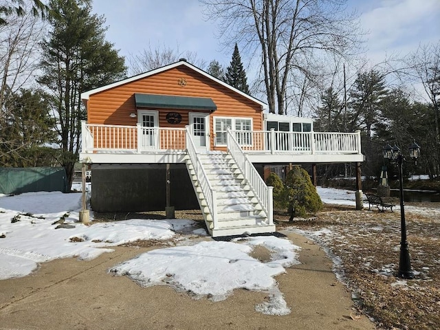 view of front of property with a sunroom