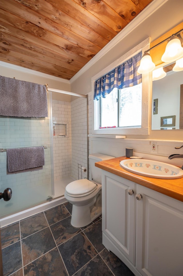 bathroom featuring vanity, toilet, walk in shower, ornamental molding, and wooden ceiling