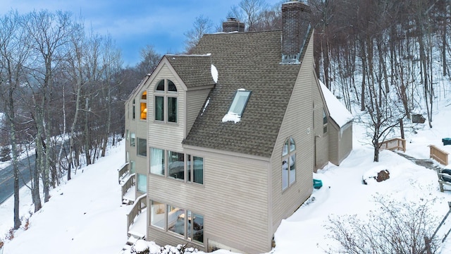 view of snow covered house