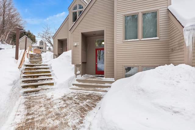 view of snow covered property entrance